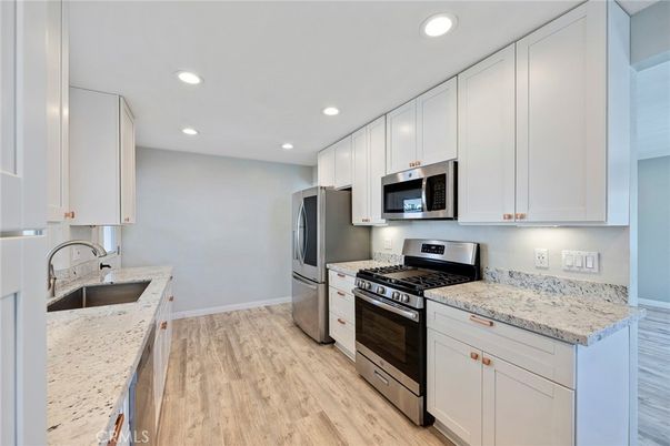 Interior, Kitchen, Recessed Lighting, Stainless Steel Appliances, Wood Texture Flooring