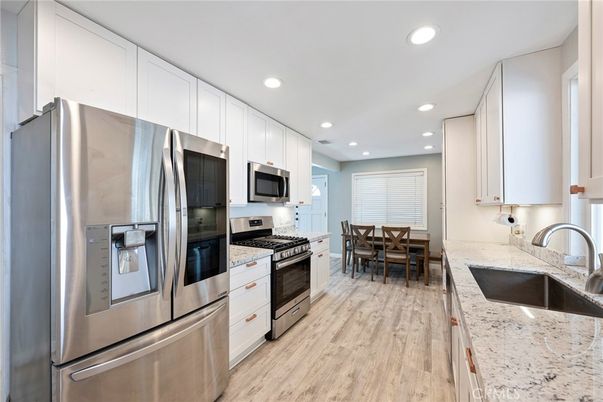 Dining room, Interior, Kitchen, Recessed Lighting, Stainless Steel Appliances, Wood Texture Flooring