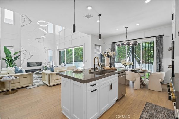 Dining room, Fireplace, Interior, Kitchen, Living room, Marble Walls, Pendant Lights, Recessed Lighting, Wood Texture Flooring