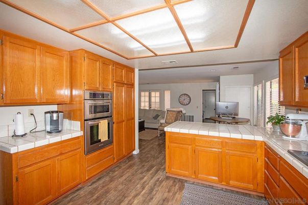 Interior, Kitchen, Living room, Stainless Steel Appliances, Tile Countertops, Wood Texture Flooring