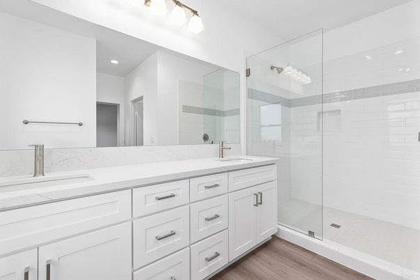 Bathroom, Dual Sink Vanities, Glass Shower, Interior, Recessed Lighting, Wood Texture Flooring
