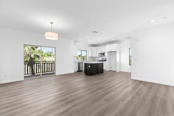 Empty room, Interior, Kitchen, Pendant Lights, Recessed Lighting, Stainless Steel Appliances, Wood Texture Flooring