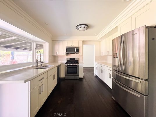 Fireplace, Interior, Kitchen, Recessed Lighting, Stainless Steel Appliances, Wood Texture Flooring