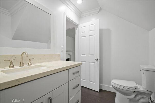 Empty room, Interior, Kitchen, Recessed Lighting, Stainless Steel Appliances, Wood Texture Flooring