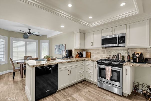 Dining room, Interior, Kitchen, Recessed Lighting, Stainless Steel Appliances, Wood Texture Flooring