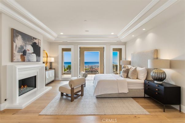 Bedroom, Fireplace, Interior, Recessed Lighting, Water, Wood Texture Flooring