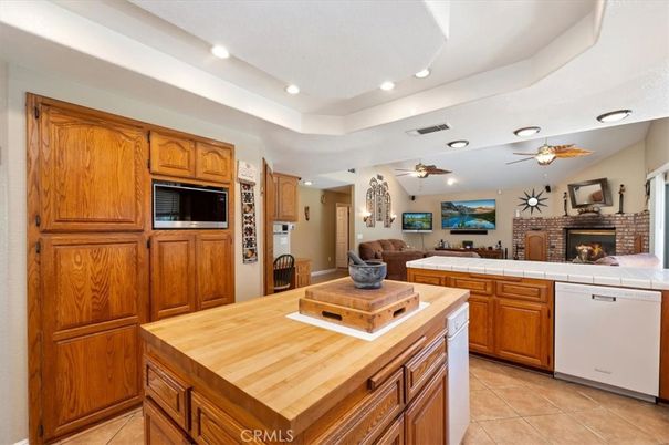 Fireplace, Interior, Kitchen, Recessed Lighting, Tile Countertops