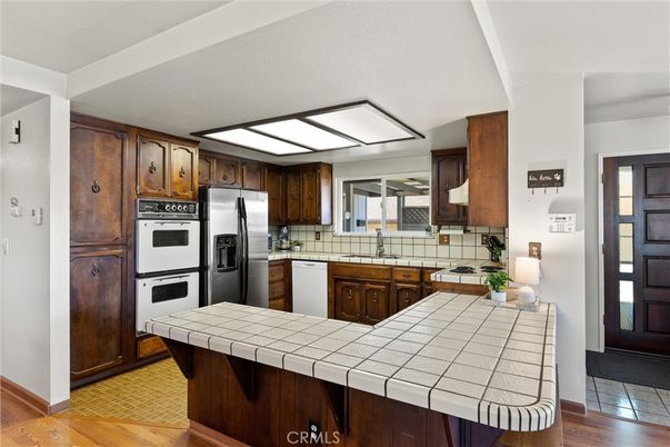 Interior, Kitchen, Stainless Steel Appliances, Tile Countertops, Wood Texture Flooring