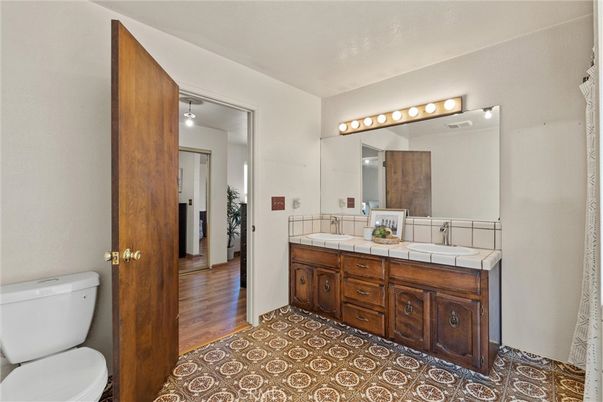 Bathroom, Dual Sink Vanities, Interior, Tile Countertops, Wood Texture Flooring