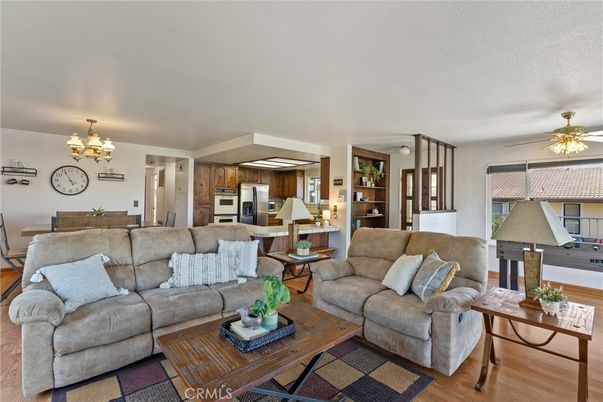 Chandelier, Dining room, Interior, Kitchen, Living room, Stainless Steel Appliances, Wood Texture Flooring
