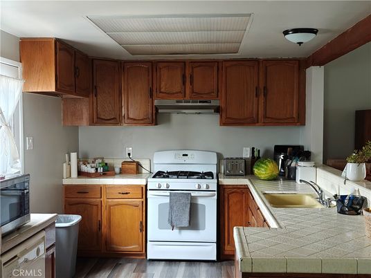 Interior, Kitchen, Tile Countertops, Wood Texture Flooring