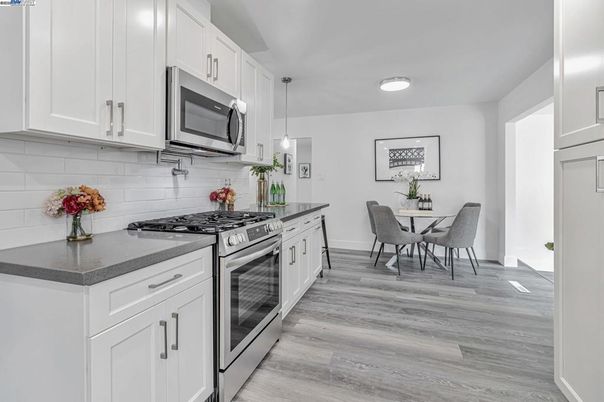 Dining room, Interior, Kitchen, Pendant Lights, Stainless Steel Appliances, Wood Texture Flooring