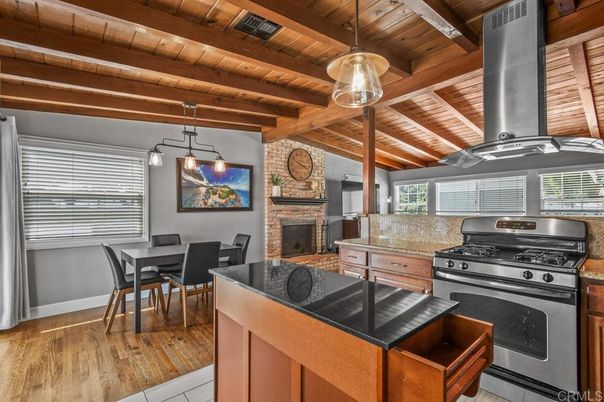Dining room, Fireplace, Interior, Kitchen, Pendant Lights, Stainless Steel Appliances, Stone Walls, Wooden Beams, Wooden Ceilings, Wood Texture Flooring