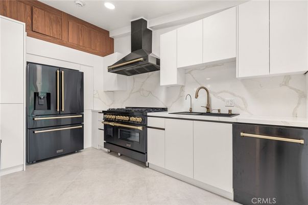 Interior, Kitchen, Marble Walls, Recessed Lighting, Stainless Steel Appliances