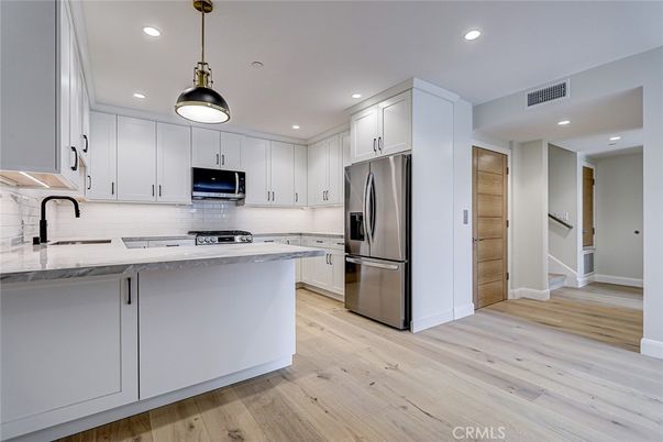 Interior, Kitchen, Pendant Lights, Recessed Lighting, Stainless Steel Appliances, Wood Texture Flooring