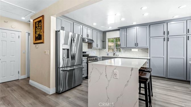 Interior, Kitchen, Marble Walls, Recessed Lighting, Stainless Steel Appliances, Wood Texture Flooring