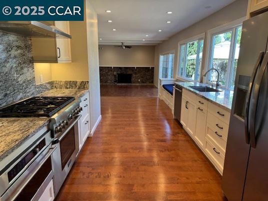 Interior, Kitchen, Recessed Lighting, Stainless Steel Appliances, Stone Walls, Wood Texture Flooring