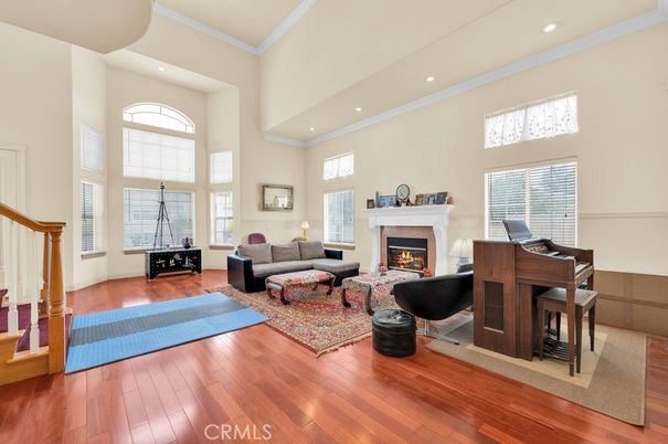 Fireplace, Interior, Living room, Piano, Recessed Lighting, Wood Texture Flooring