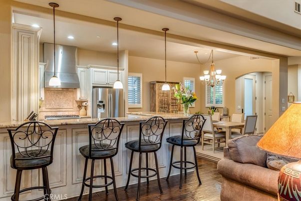 Chandelier, Dining room, Interior, Kitchen, Pendant Lights, Recessed Lighting, Stainless Steel Appliances, Wood Texture Flooring