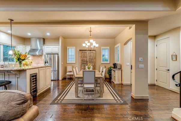 Chandelier, Dining room, Interior, Kitchen, Pendant Lights, Recessed Lighting, Stainless Steel Appliances, Wood Texture Flooring