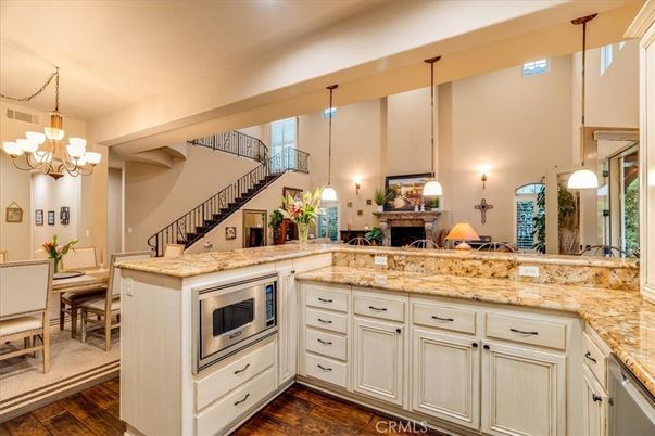 Chandelier, Dining room, Fireplace, Interior, Kitchen, Pendant Lights, Wood Texture Flooring