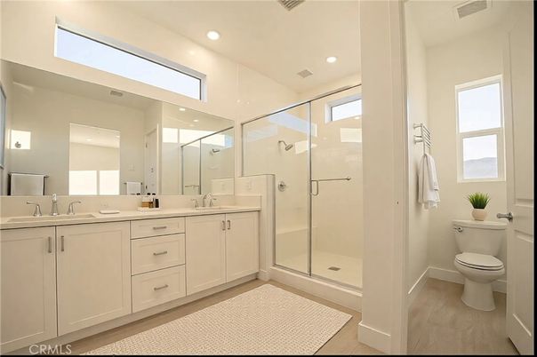 Bathroom, Dual Sink Vanities, Glass Shower, Interior, Recessed Lighting, Wood Texture Flooring