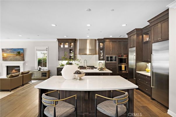 Fireplace, Interior, Kitchen, Living room, Recessed Lighting, Stainless Steel Appliances, Wood Texture Flooring
