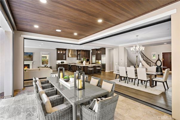 Chandelier, Dining room, Fireplace, Interior, Kitchen, Living room, Recessed Lighting, Wooden Ceilings, Wood Texture Flooring