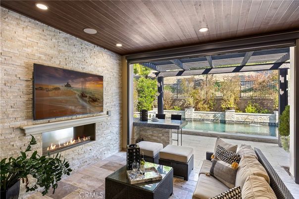 Exterior, Fireplace, Living room, Pool, Recessed Lighting, Stone Walls
