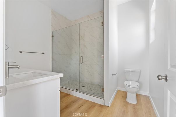Bathroom, Glass Shower, Interior, Marble Walls, Wood Texture Flooring