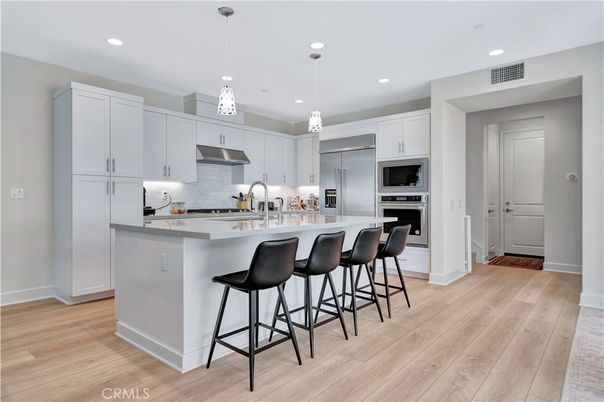 Interior, Kitchen, Pendant Lights, Recessed Lighting, Stainless Steel Appliances, Wood Texture Flooring