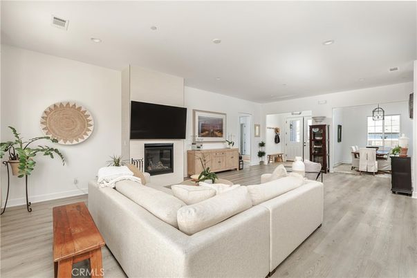 Dining room, Fireplace, Interior, Living room, Pendant Lights, Recessed Lighting, Wood Texture Flooring