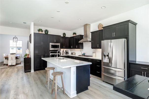 Dining room, Interior, Kitchen, Recessed Lighting, Stainless Steel Appliances, Wood Texture Flooring