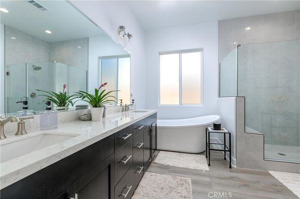 Bathroom, Dual Sink Vanities, Free Standing Baths, Glass Shower, Interior, Recessed Lighting, Wood Texture Flooring