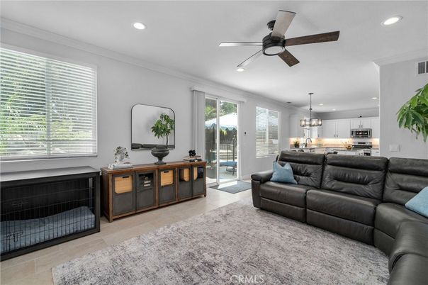 Chandelier, Interior, Kitchen, Living room, Pendant Lights, Recessed Lighting, Stainless Steel Appliances, Wood Texture Flooring