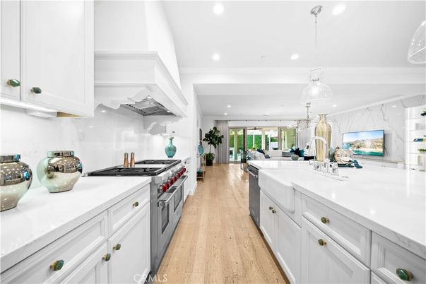 Interior, Kitchen, Marble Walls, Pendant Lights, Recessed Lighting, Stainless Steel Appliances, Wood Texture Flooring
