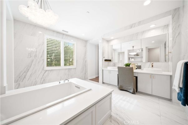 Bathroom, Chandelier, Dual Sink Vanities, Interior, Marble, Marble Walls, Pendant Lights, Recessed Lighting