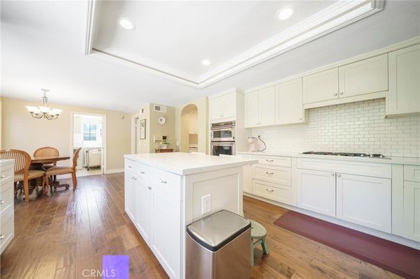 Chandelier, Dining room, Interior, Kitchen, Recessed Lighting, Stainless Steel Appliances, Wood Texture Flooring