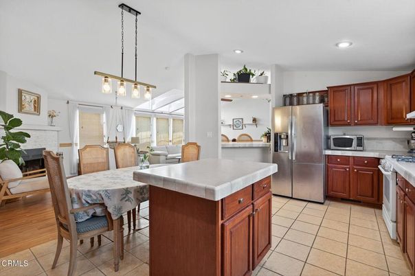 Dining room, Fireplace, Interior, Kitchen, Pendant Lights, Recessed Lighting, Stainless Steel Appliances, Wood Texture Flooring