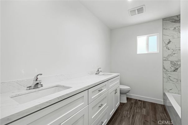 Bathroom, Dual Sink Vanities, Interior, Marble Walls, Wood Texture Flooring