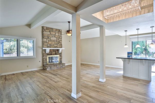 Empty room, Fireplace, Interior, Pendant Lights, Stone Walls, Wood Texture Flooring