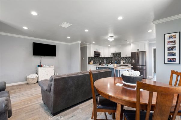 Dining room, Interior, Kitchen, Living room, Recessed Lighting, Stainless Steel Appliances, Wood Texture Flooring