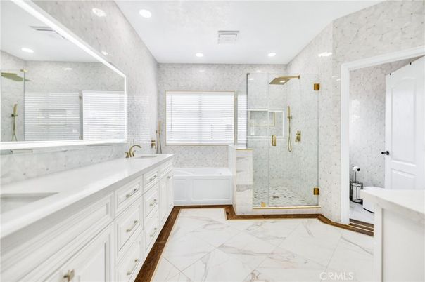 Bathroom, Dual Sink Vanities, Glass Shower, Interior, Marble, Marble Walls, Recessed Lighting