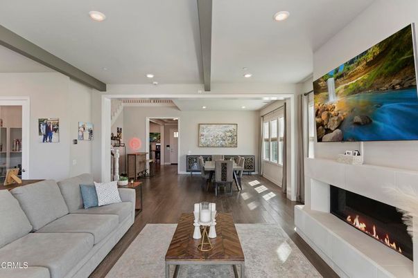Dining room, Fireplace, Interior, Living room, Recessed Lighting, Wood Texture Flooring