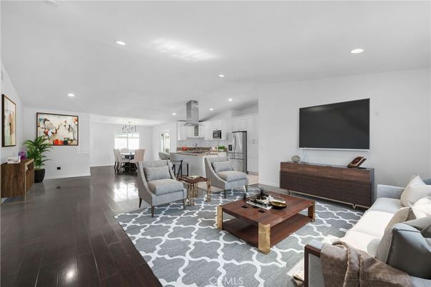 Chandelier, Dining room, Interior, Kitchen, Living room, Pendant Lights, Recessed Lighting, Stainless Steel Appliances, Wood Texture Flooring