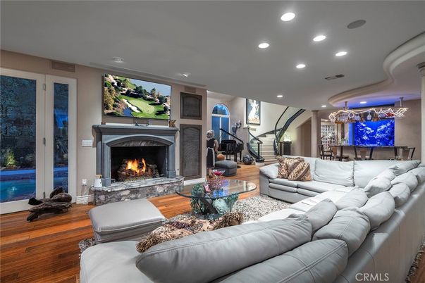 Chandelier, Dining room, Fireplace, Interior, Living room, Recessed Lighting, Wood Texture Flooring
