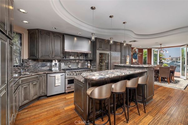 Dining room, Interior, Kitchen, Pendant Lights, Recessed Lighting, Stainless Steel Appliances, Wood Texture Flooring