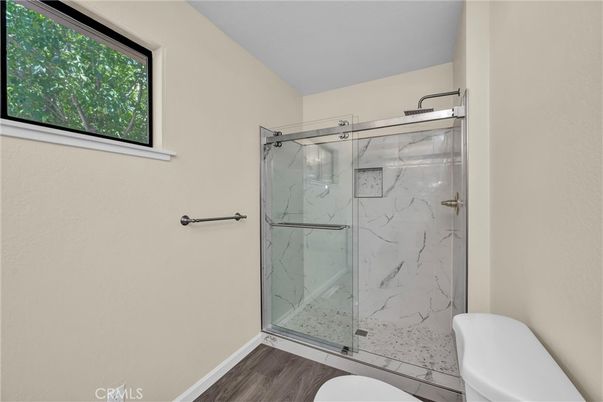 Bathroom, Glass Shower, Interior, Marble Walls, Wood Texture Flooring
