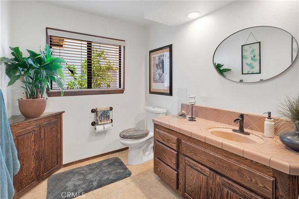 Bathroom, Dual Sink Vanities, Interior, Recessed Lighting, Tile Countertops