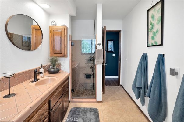 Bathroom, Dual Sink Vanities, Glass Shower, Interior, Recessed Lighting, Tile Countertops